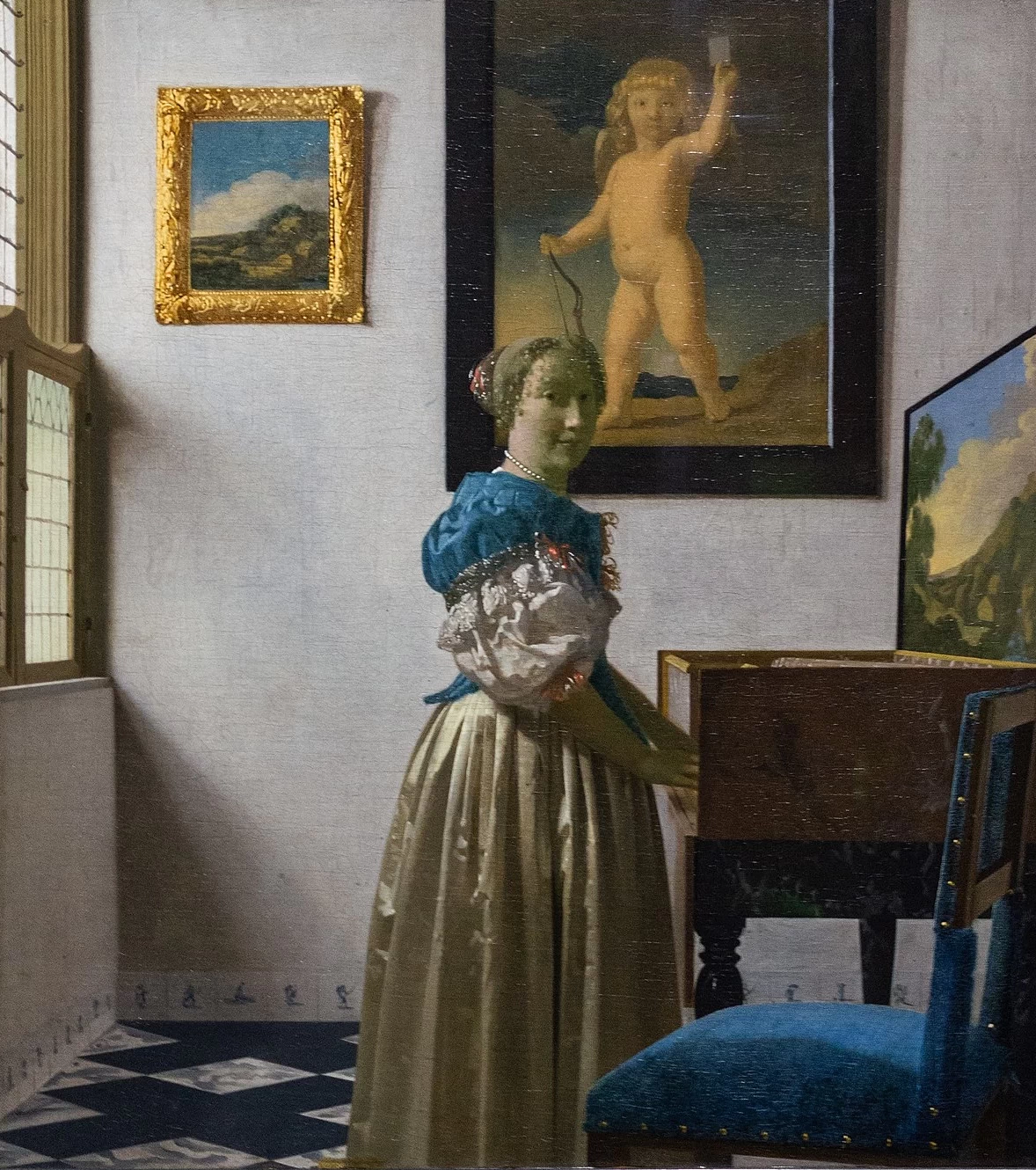 Una giovane donna in piedi davanti alla spinetta - National Gallery, Londra